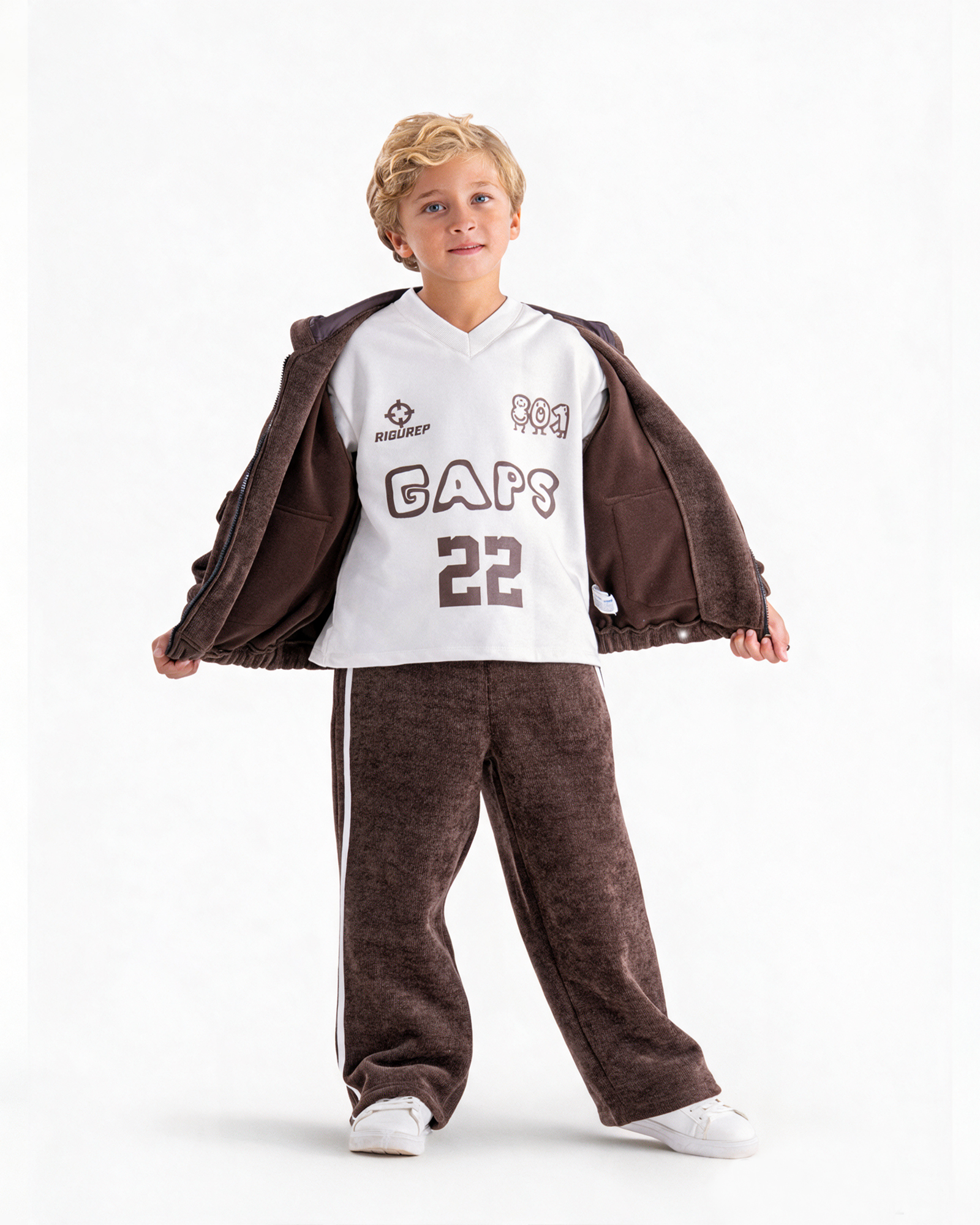 Stedrino Kids Wear 2 Boy wearing a brown jacket, printed top and brown trousers from Stedrino